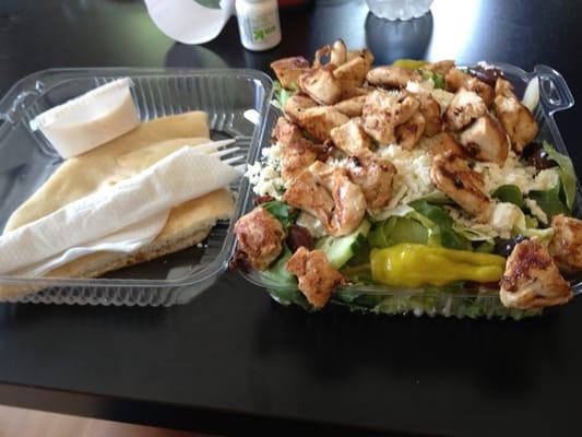 Greek salad with Grilled Chicken - large portion of perfectly seasoned grilled chicken on top of a very fresh salad.  Yum!