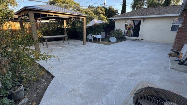 Backyard renovation: An existing patio was extended and tiled, and a gazebo was added.