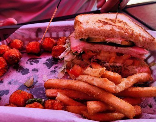 1/2 Turkey, Avocado Supreme sandwich with some sweet potato tots and some crispy fries