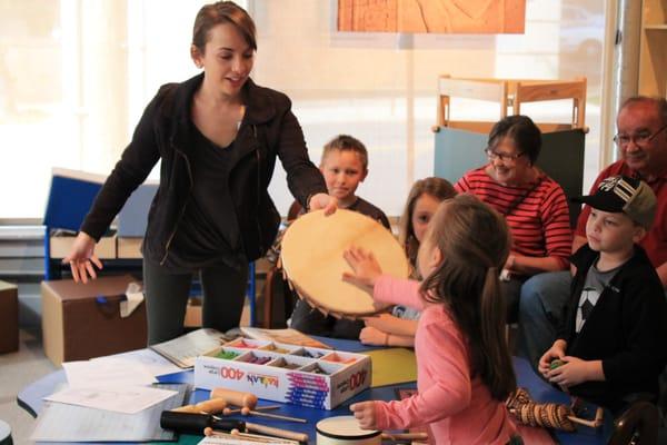 The Museums Education Program Coordinator, teaches about Egyptian music during a Mummy and Me program.