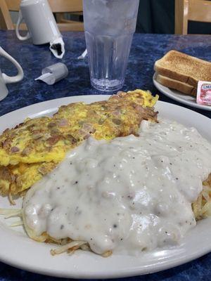 Meat lovers omelette and hash browns smothered in gravy! Very delicious!