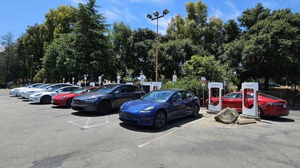 high-usage supercharger station. all 8 stalls in use