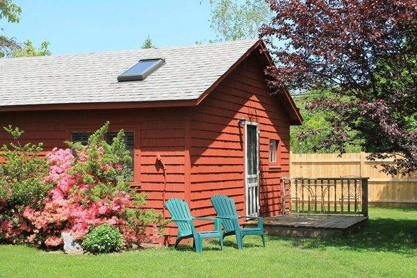 Large Cottage #9 - bedroom, bathroom, living room, and kitchenette for up to 4 guests.