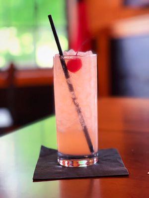 The Slayer: strawberry liqueur, applejack, sugar, lemon, bitters, soda