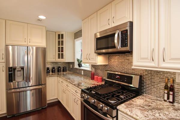 American Maple Solid Wood, Foil Glass Mosaic Tile and Bianco Antico Granite.