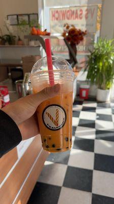 Thai Tea boba drink (tapioca pearls included) + lychee popping pearls ($1)