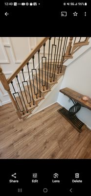 Handrails and pickets install and laminate flooring on stairs