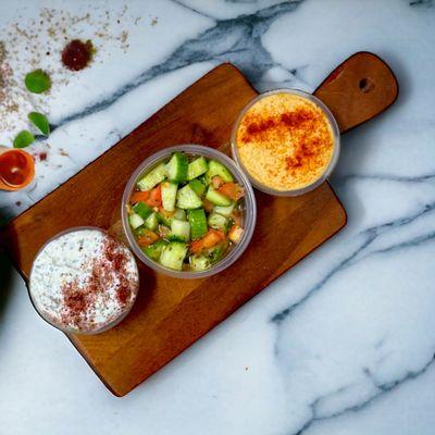 Mediterranean salad, homemade tzatziki with homemade yogurts, fresh homemade hummus