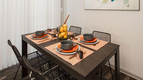 Apartment Dining room with wood floors.