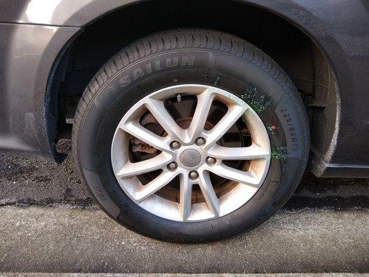 Replaced tire #1. You can see the old green slime residue still... I kinda feel bad for the guy who separated the old tire.