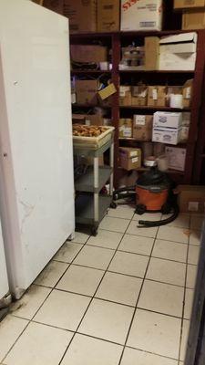 Cooked chicken sitting uncovered in an unrefrigerated storeroom. This place is disgusting.