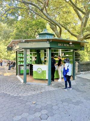 My wife waiting to rent our bicycles at the bike rental kiosk.