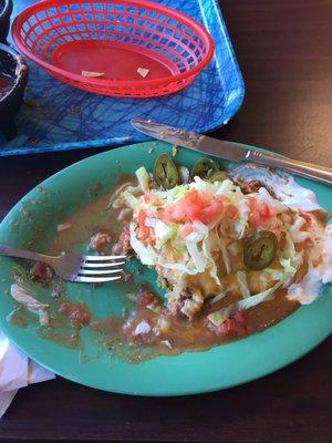 Half eaten and still bigger than my head! The smothered wet burrito is great! Eat here