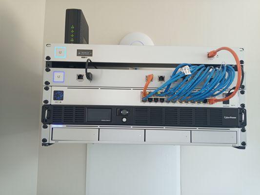 Network rack that Mustang installed for networking, WiFi, and camera system with video door bell.