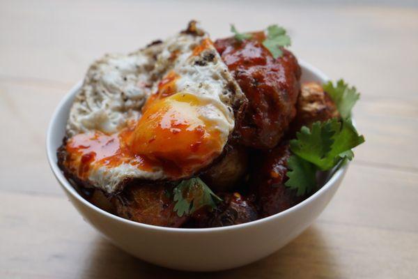 Potatoes, Sriracha, sausage, fried egg.  All around deliciousness