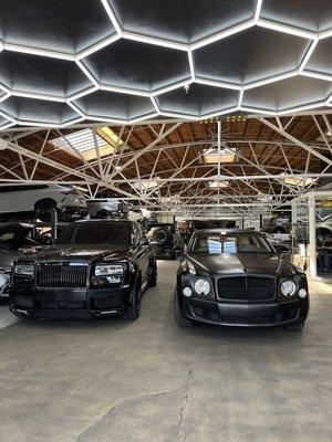 Widebody Rolls Royce cullinan and a wrapped Bentley Muslanne inside RDB.