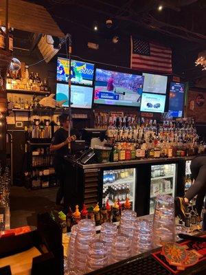 Bar scene with big screen sports