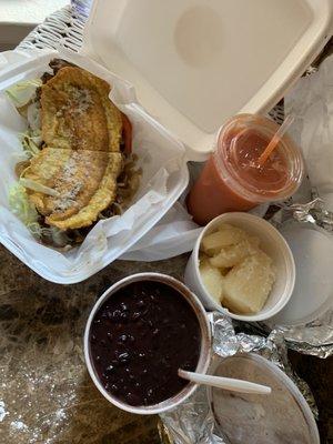 Bistec Jibarito (steak plantain sandwich), Yuca con Mojo, Frijoles Negros, Mamey Smoothie