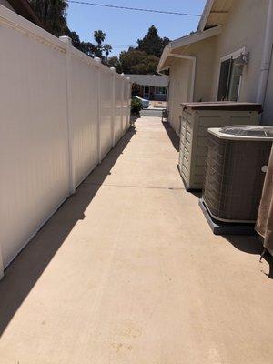 The colored cement (Omaha Tan) on the side yard and now drains perfectly. A/C is now on cement slab.