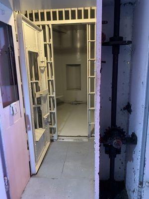 Cell entrance with gears on right