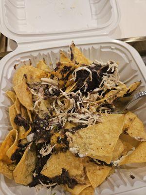 Sad chicken nachos with fry chicken and no guac, no sour cream, no pico de gallo.