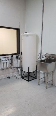 Commercial RO system with 100 gallons storage tank and UV light.