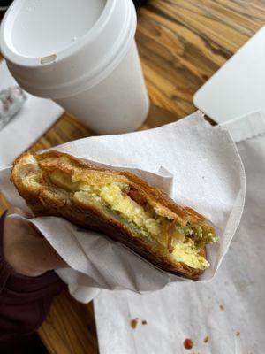 Almond chai ($5.75, 12oz), pesto tomato feta breakfast sandwich on croissant ($5.95)