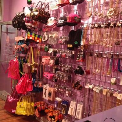 Accessory wall with bags, hats, jewelry and misc. items.