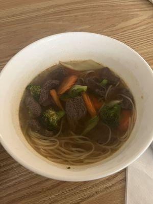 Big bowl noodle soup with beef