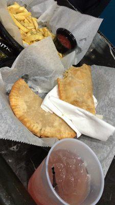 Chicken empanadas, French fries and a Tito with cranberry and pineapple.