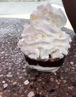 Small hot fudge sundae with chopped peanuts and whip cream $2.80-something. Tasty.