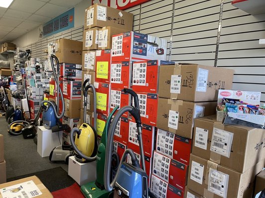 Vacuums piled to the ceiling