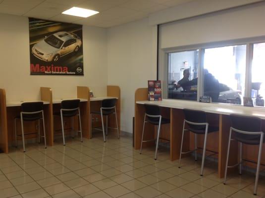 Waiting area where you can watch your vehicle being worked on or use as your own personal workspace