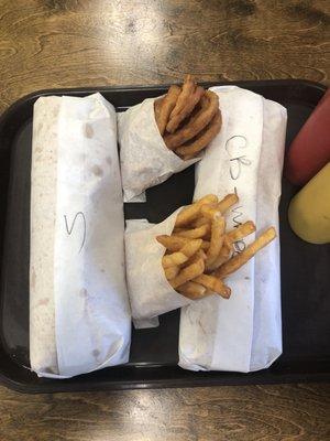 2 large Po Boys , Onion Rings and Crispy Fries