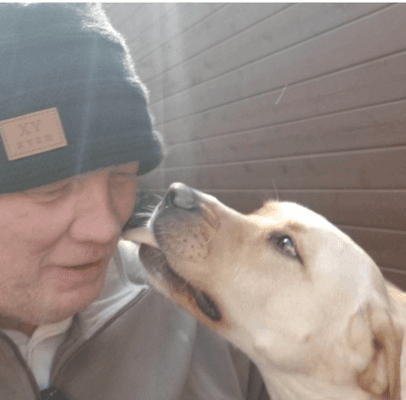 Sheriff Dave getting a warm greeting from his buddy, Buddy