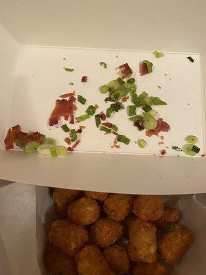 All of the bacon on my tater tot order.