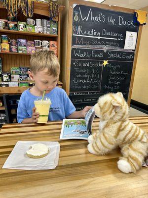 A dreamsicle drink with a sugar cookie and his new stuffy and Pete the cat book ! 3