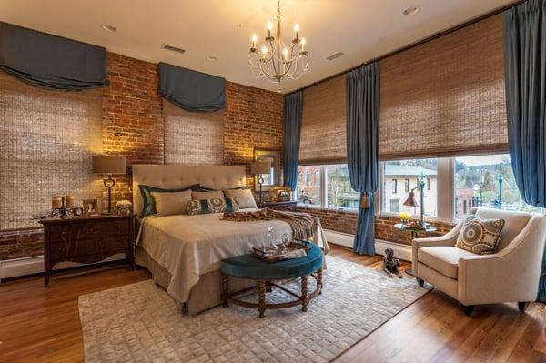 Loft apartment master bedroom.  We can help with all furniture, drapes, blinds and bedding !