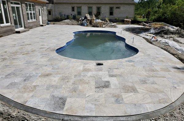 Travertine pool deck.