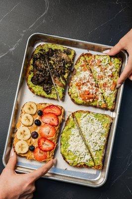 From left to right: Avoday I'm Shrommin', Guac Toast, BYO Nut Butter Toast, Smashed Avo Toast