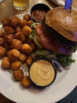 Veggie burger with sweet potato tots