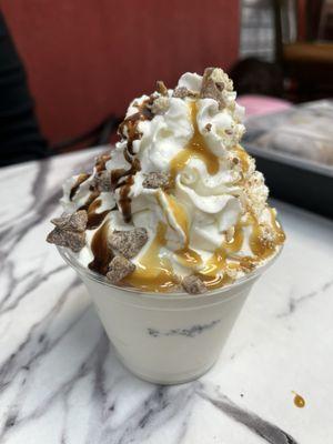 Sundae with chocolate and caramel sauces and Twix bits