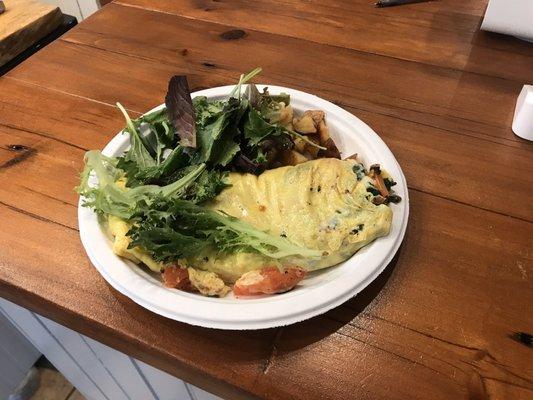 Sunday brunch with just the right amount of decedent homestyle home-fries tucked between the omelet and the fresh salad.