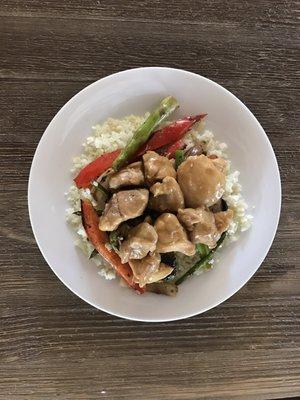 Orange Chicken over Aspeagus and Pepper Medley and a White Cauliflower Rice.