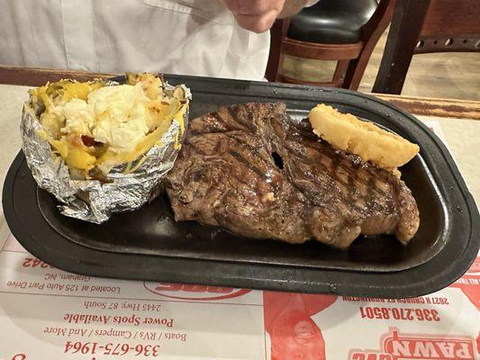 Loaded potato and juicy steak cooked medium