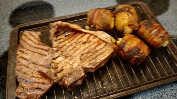 Porterhouse and NY Strip withe cheddar bacon potato bombs. Steaks bought at Acropolis, enjoyed by my family.