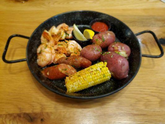 Low Country Boil of shrimp,  sausage, potatoes & corn on the cob!! This is a delicious dish from the Carolinas.