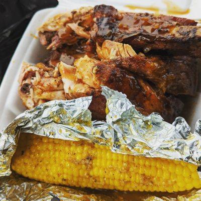 Smoked chicken drumstick, three ribs, corn on the cob