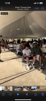 People in line to eat burgers hot dogs and nachos  The nachos were donated from panchitos