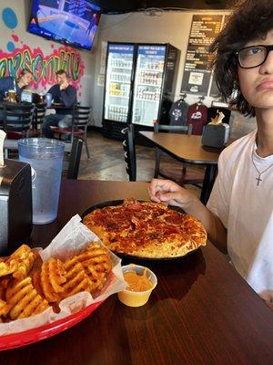 Pizza and awesome waffle fries.